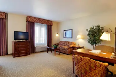 a living room with a couch and a television at Hampton Inn & Suites Lodi in Lodi