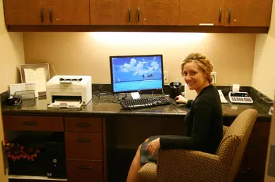 a woman sitting at a desk with a computer at Hampton Inn & Suites Lodi in Lodi