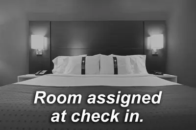a bedroom with a bed with a room assessed at check in at Holiday Inn Express Hotel & Suites Manteca by IHG in Manteca