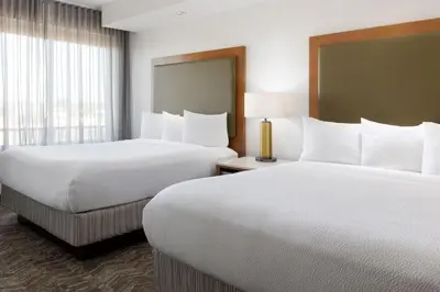 a hotel room with two beds and a window at SpringHill Suites by Marriott Sacramento Roseville in Roseville
