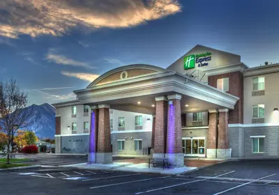a hotel in a parking lot with a building at Holiday Inn Express Hotel & Suites Minden by IHG in Minden