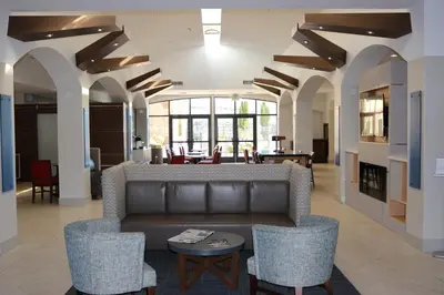 a living room with a couch and chairs at Holiday Inn Express Hotel & Suites El Dorado Hills by IHG in El Dorado Hills