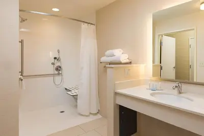 a bathroom with a sink and a shower at Fairfield Inn & Suites by Marriott Sacramento Folsom in Folsom