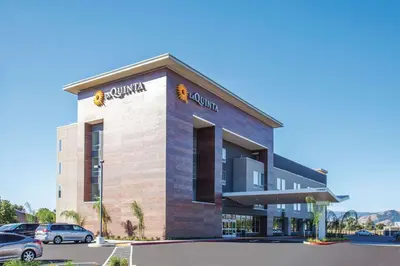 a rendering of a building with a parking lot at La Quinta by Wyndham Morgan Hill-San Jose South in Morgan Hill