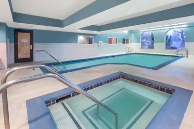 a large swimming pool in a building with a pool at Holiday Inn Express Hotel & Suites Bishop by IHG in Bishop
