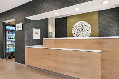 a cashier counter in a store with a mirror at Fairfield Inn by Marriott Visalia Sequoia in Visalia