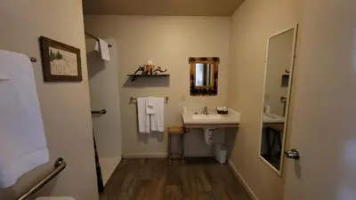 a bathroom with a sink and a mirror at Sequoia Lodge in Kernville