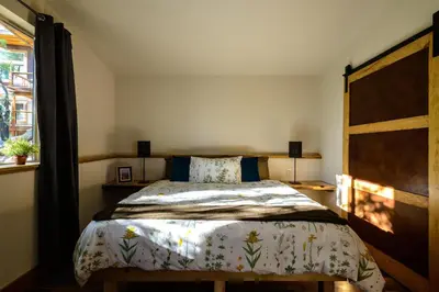 a bedroom with a bed and a window at Alpenglow 3 in Yosemite West