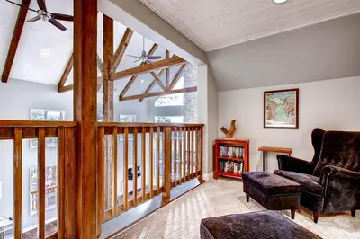 a living room with a couch and a chair at Kildrummy Lodge in Yosemite West