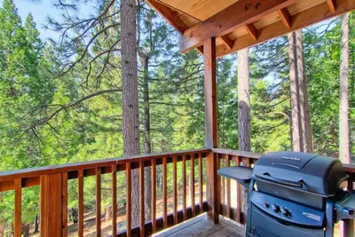 a grill sitting on the deck of a porch at Little Sport in Yosemite West