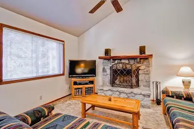 a living room with a couch and a fireplace at Little Sport in Yosemite West