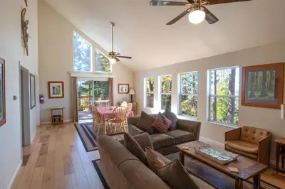 a living room with a couch and a table at Yosemite Park Place in Yosemite West
