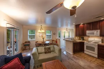 a kitchen and living room with a couch and a table at Starlight Lodge in Yosemite West