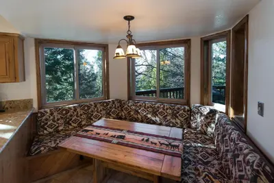 a living room with a couch and a wooden table at Four Seasons in Yosemite West