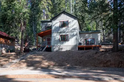 a tiny house in the middle of a forest at Boulder Ridge in Yosemite West