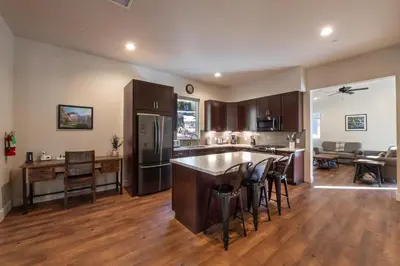an open kitchen and living room with a large island at Boulder Ridge in Yosemite West
