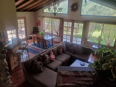 a living room with a couch and a dining room at Alta Peak Vista in Three Rivers