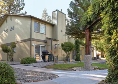 a house with a pathway in front of it at WorldMark Bass Lake in Bass Lake