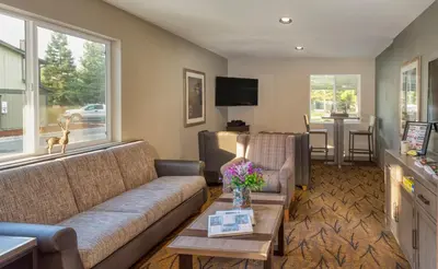 a living room with a couch and a table at WorldMark Bass Lake in Bass Lake