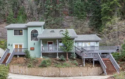 a house with two decks on a hill at Yosemite Sierra Blossom in Yosemite West