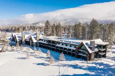 a lodge in the snow in the mountains at Edgewood Tahoe Resort in Stateline