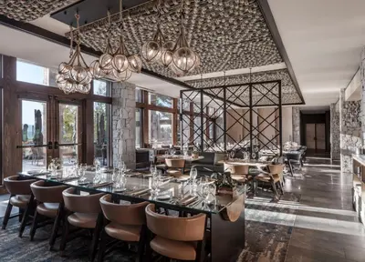 a dining room with a long table and chairs at Edgewood Tahoe Resort in Stateline