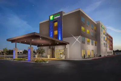 a hotel with a sign on the front of it at Holiday Inn Express Visalia-Sequoia Gateway Area by IHG in Visalia