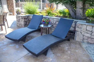 two blue chairs and a table on a patio at Chamonix # 92 in Mammoth Lakes