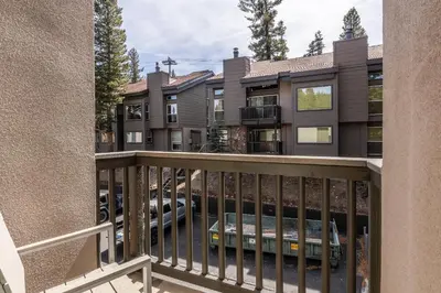 a balcony of a apartment building with a parking lot at Chamonix # 92 in Mammoth Lakes
