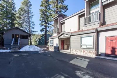 a driveway in front of a house with a red door at Chamonix # 92 in Mammoth Lakes