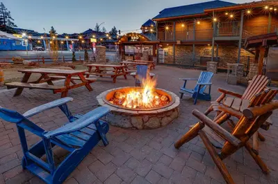 a fire pit in a patio with chairs and tables at Hotel Becket, BW Signature Collection in South Lake Tahoe