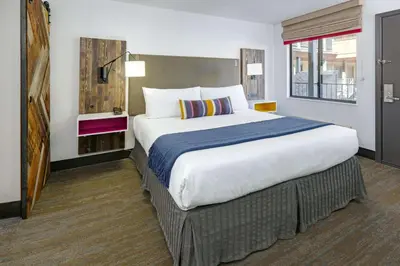 a bedroom with a large bed in a hotel room at Hotel Becket, BW Signature Collection in South Lake Tahoe