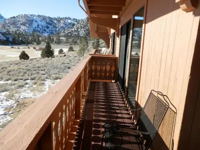 a balcony with a view of the mountains at Rr-interlaken 29 in June Lake