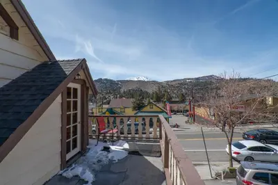 a balcony of a house with a view of a mountain at Rainbow Ridge B - 1BR/1BA in June Lake