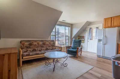 a living room with a couch and a table at Rainbow Ridge B - 1BR/1BA in June Lake
