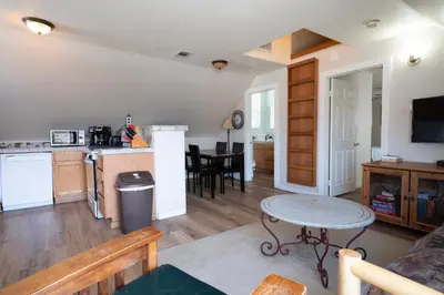 a kitchen and a living room with a table at Rainbow Ridge B - 1BR/1BA in June Lake
