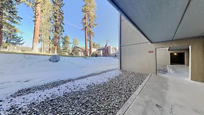 a building with a door in the snow at Lakeview 826 Condo #108 Condo in Mammoth Lakes