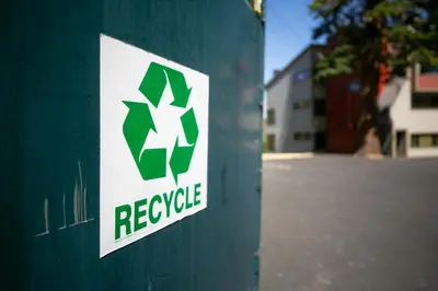 a recycle sign on the side of a green pole at Spacious Condo Great For Friends And Families! in Mammoth Lakes