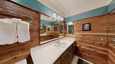a bathroom with a sink and a mirror at Comfortable 4 Bedroom Condo in Mammoth Lakes
