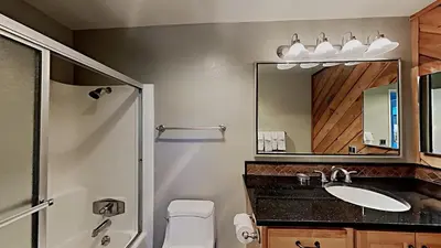 a bathroom with a sink and a mirror at Lakeview 826 Condo #553 Condo in Mammoth Lakes