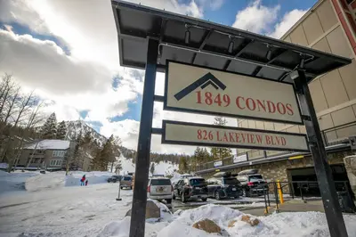 a sign in front of a building in the snow at Lakeview 826 Condo #553 Condo in Mammoth Lakes