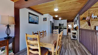 a dining room and kitchen with a table and chairs at Spacious 2 Bedroom Condo in Mammoth Lakes
