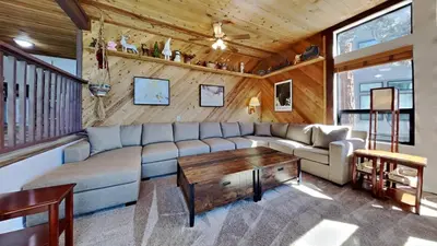 a living room with a couch and a table at Spacious 2 Bedroom Condo in Mammoth Lakes