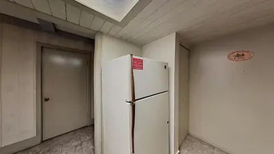 a white refrigerator in a room with a ceiling at Beautiful 2 BR Condo with Mountain View! in Mammoth Lakes