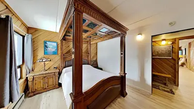 a bedroom with a canopy bed in a house at Great 3 Bedroom Condo with Washer and Dryer! in Mammoth Lakes