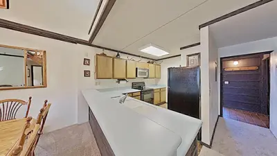 a kitchen with a large white counter in a room at Comfortable Cozy 2 Bedroom Condo with Loft! in Mammoth Lakes