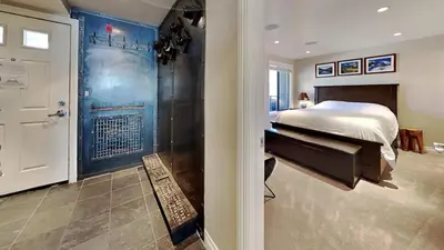 a bedroom with a bed and a walk in shower at Beautiful 2 Bedroom Condo with Amazing View! in Mammoth Lakes
