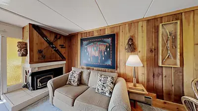 a living room with a couch and a fireplace at Great 2 Bedroom Condo with Mountain View! in Mammoth Lakes
