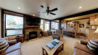 a living room with a couch and a fireplace at Lakeview 826 Condo #532 Condo in Mammoth Lakes