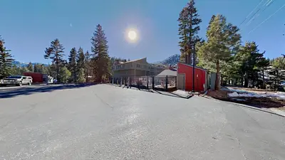 an empty street with the moon in the sky at Nicely Remodeled 2 Bedroom Condo in Mammoth! in Mammoth Lakes